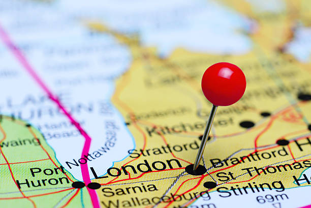 Photo of pinned London on a map of Canada. May be used as illustration for traveling theme.